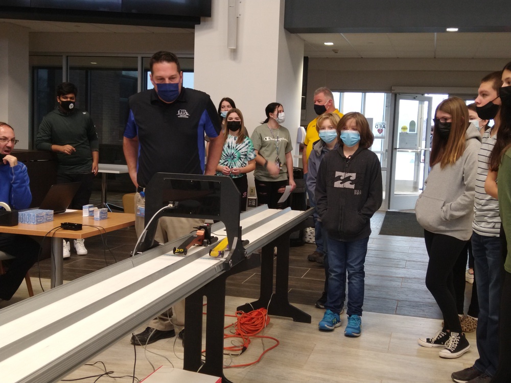Students participating in car race at Tech Wars