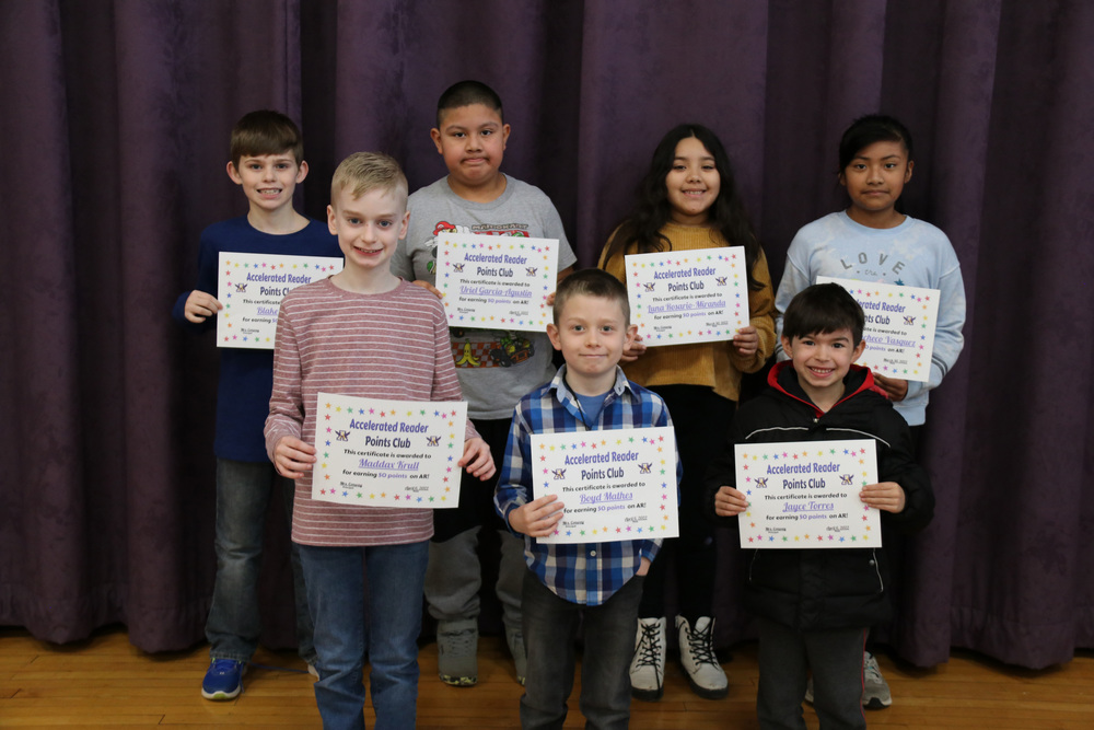 AR students pose with their certificates