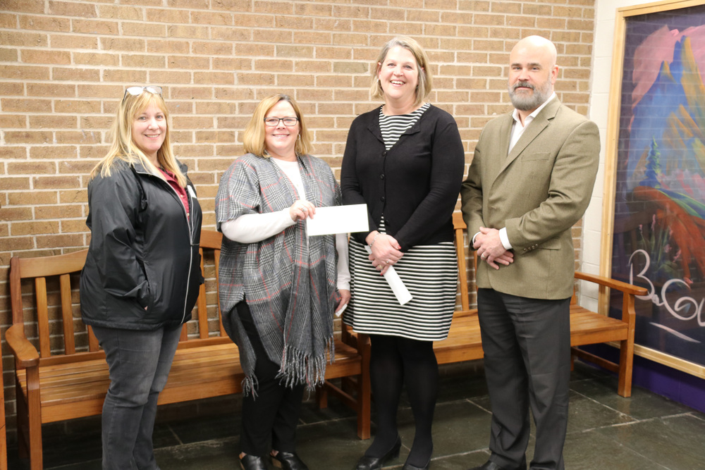 reps from Crosby-Reid Petroleum present check to Principal Ashbery and Superintendent Edwards