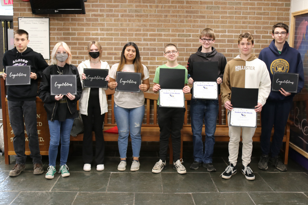 HS students of the month pose with certificates