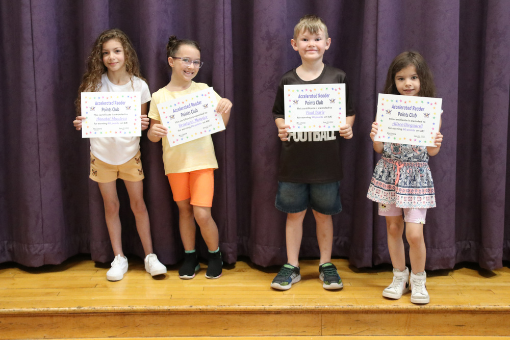 Accelerated Reader achievers pose with their certificates