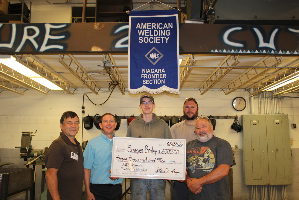 Sawyer Braley holds his check