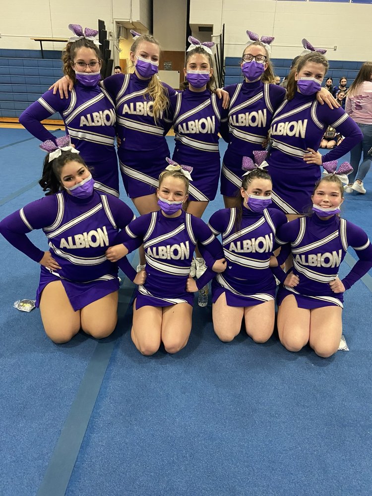 cheerleading squad poses at all-league meet
