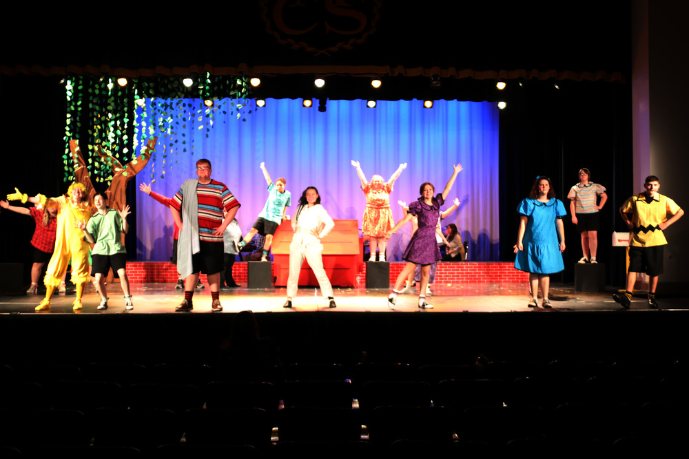 the cast of Snoopy on stage