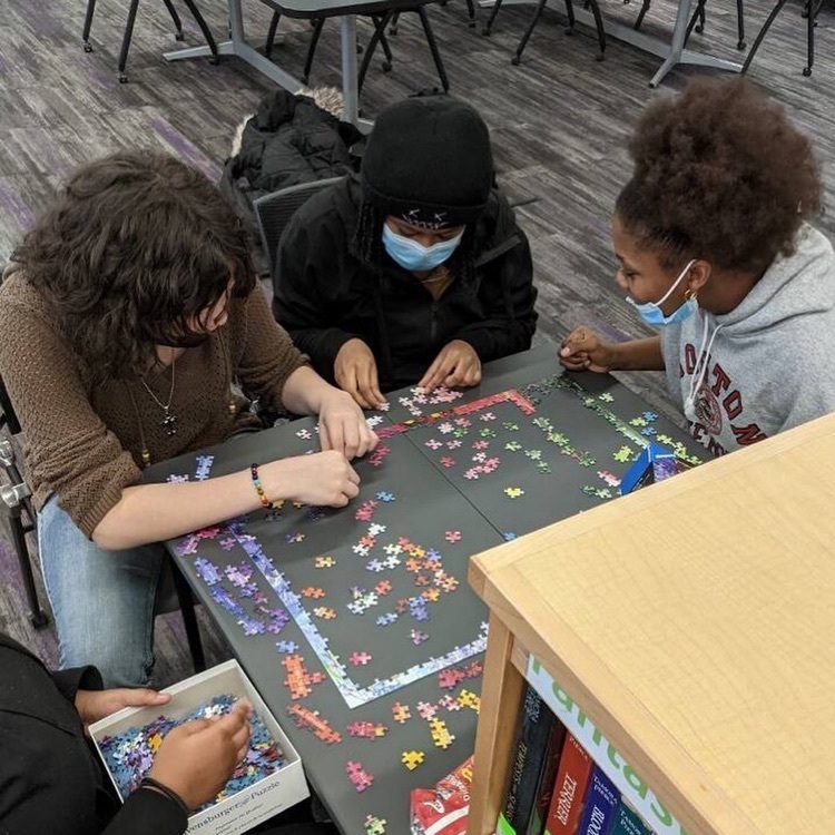 students working on a puzzle