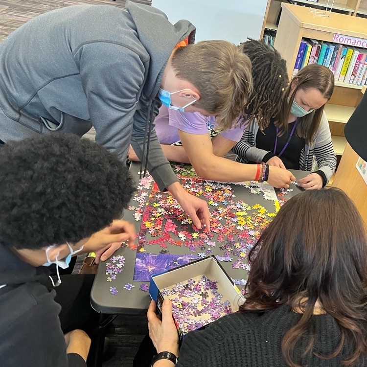 students working on a puzzle