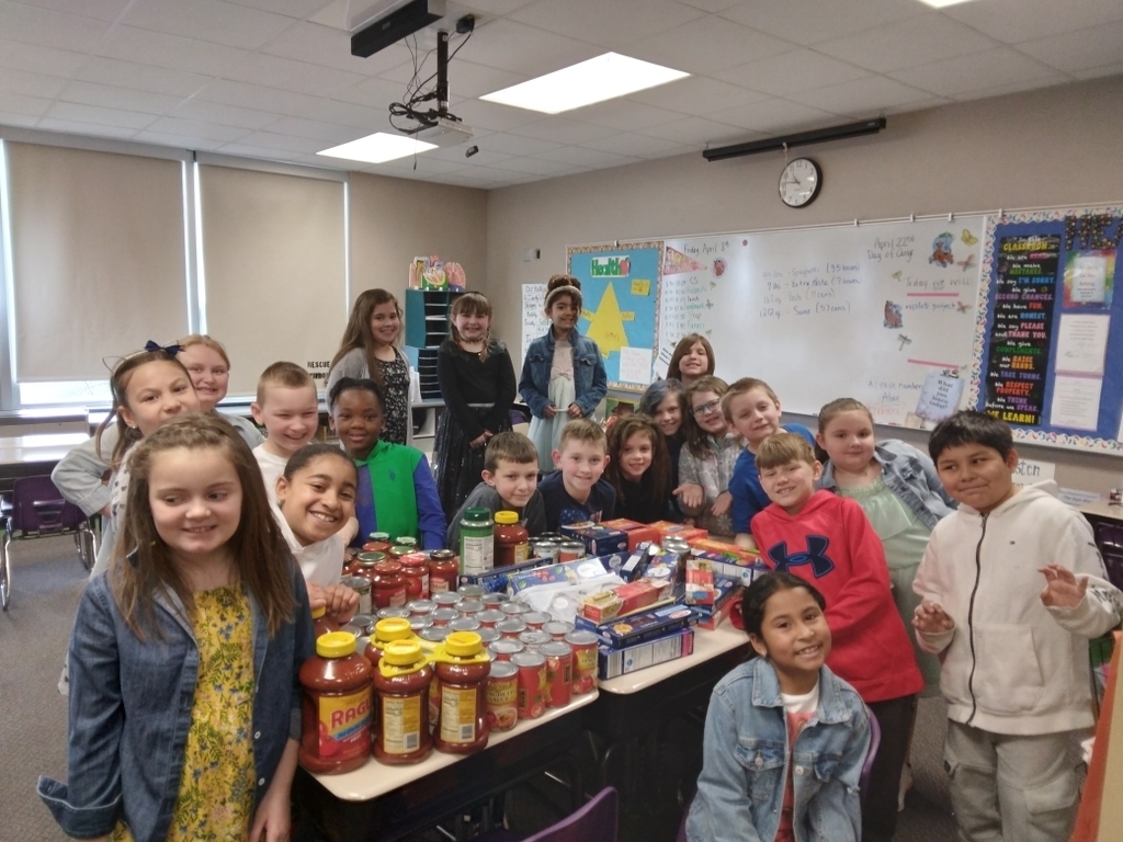 students show off all the food they collected