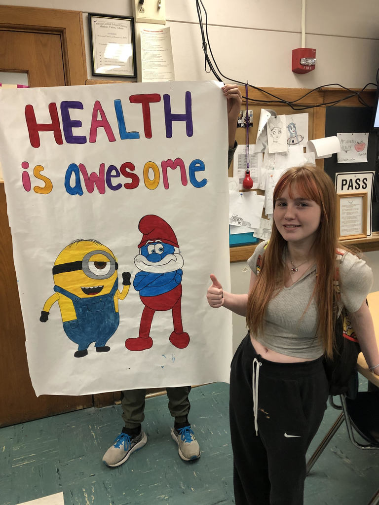 student shows off her artwork
