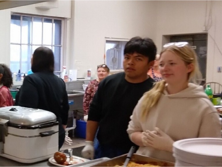 students serve food