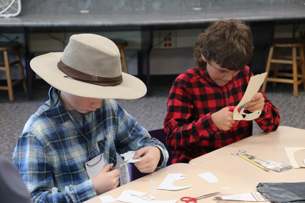 students work on paper crafts