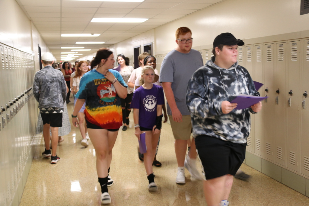 students walk down the hall