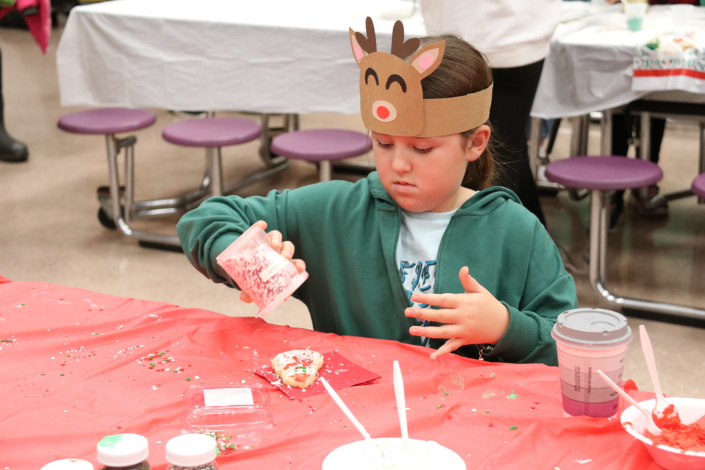 a student decorates a cookie