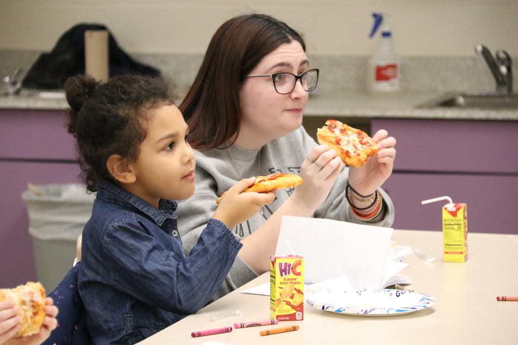 students enjoy the pizza they made