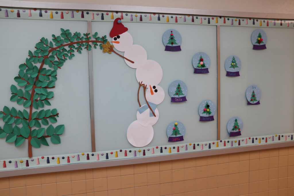 bulletin board with snowmen and snow globes