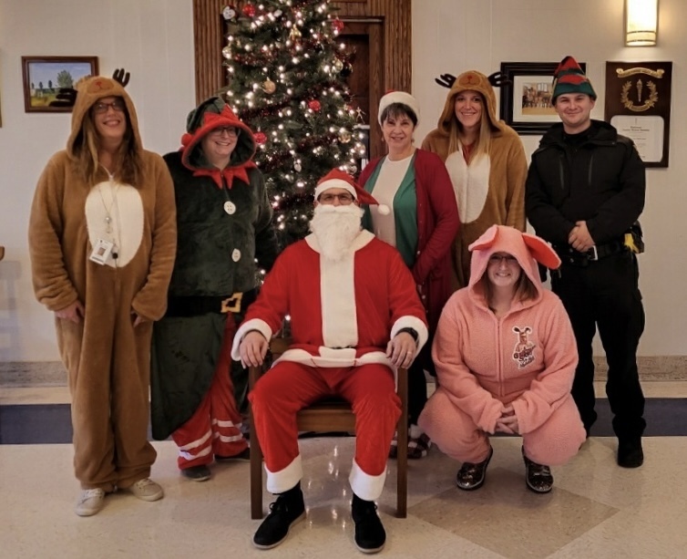 staff dressed as Christmas characters