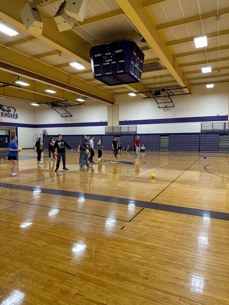 students play dodgeball in the gym
