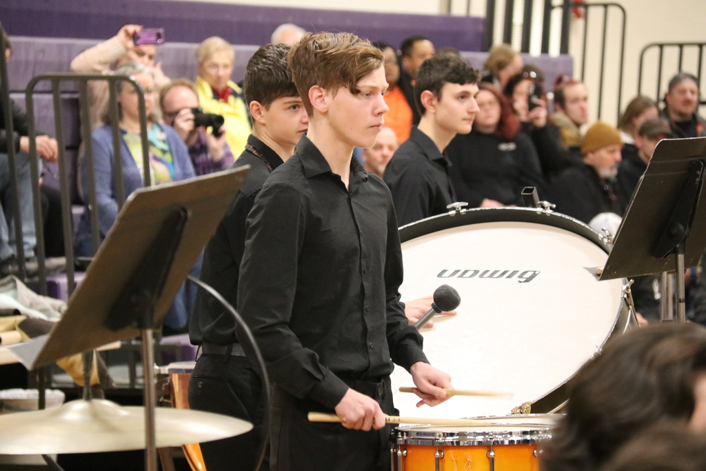 a high school student plays the drums