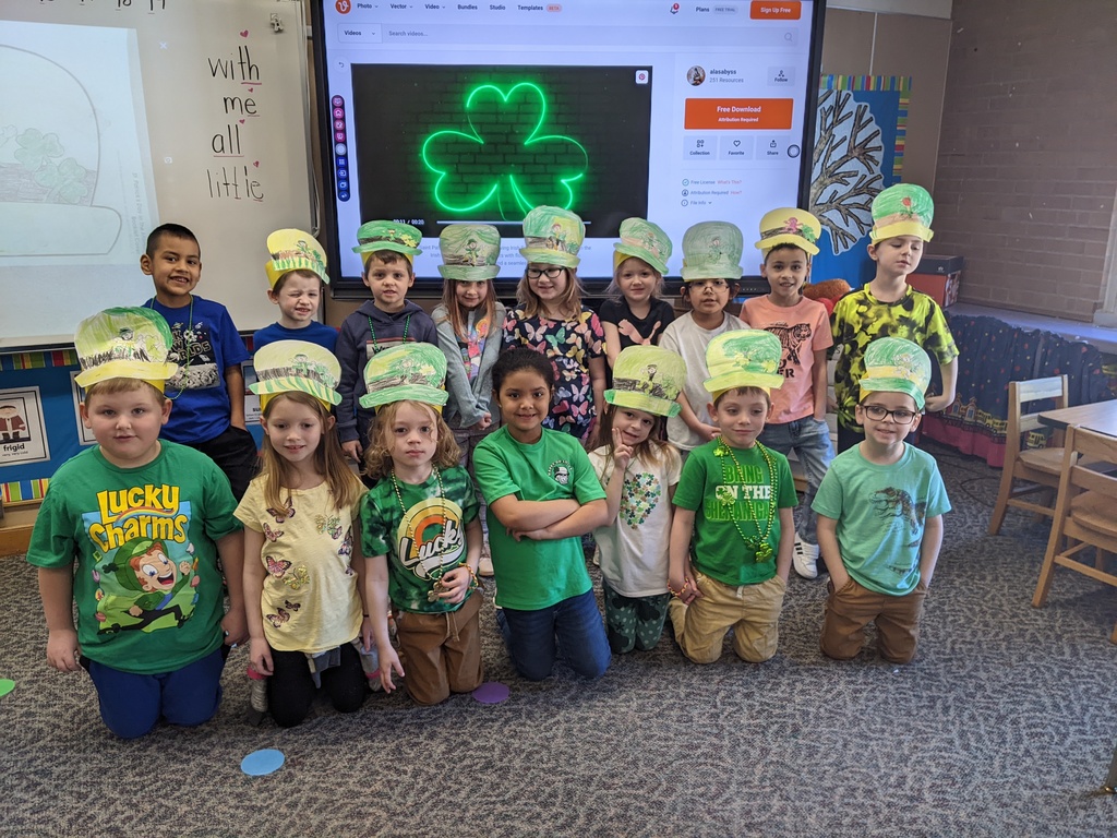 students dressed in green